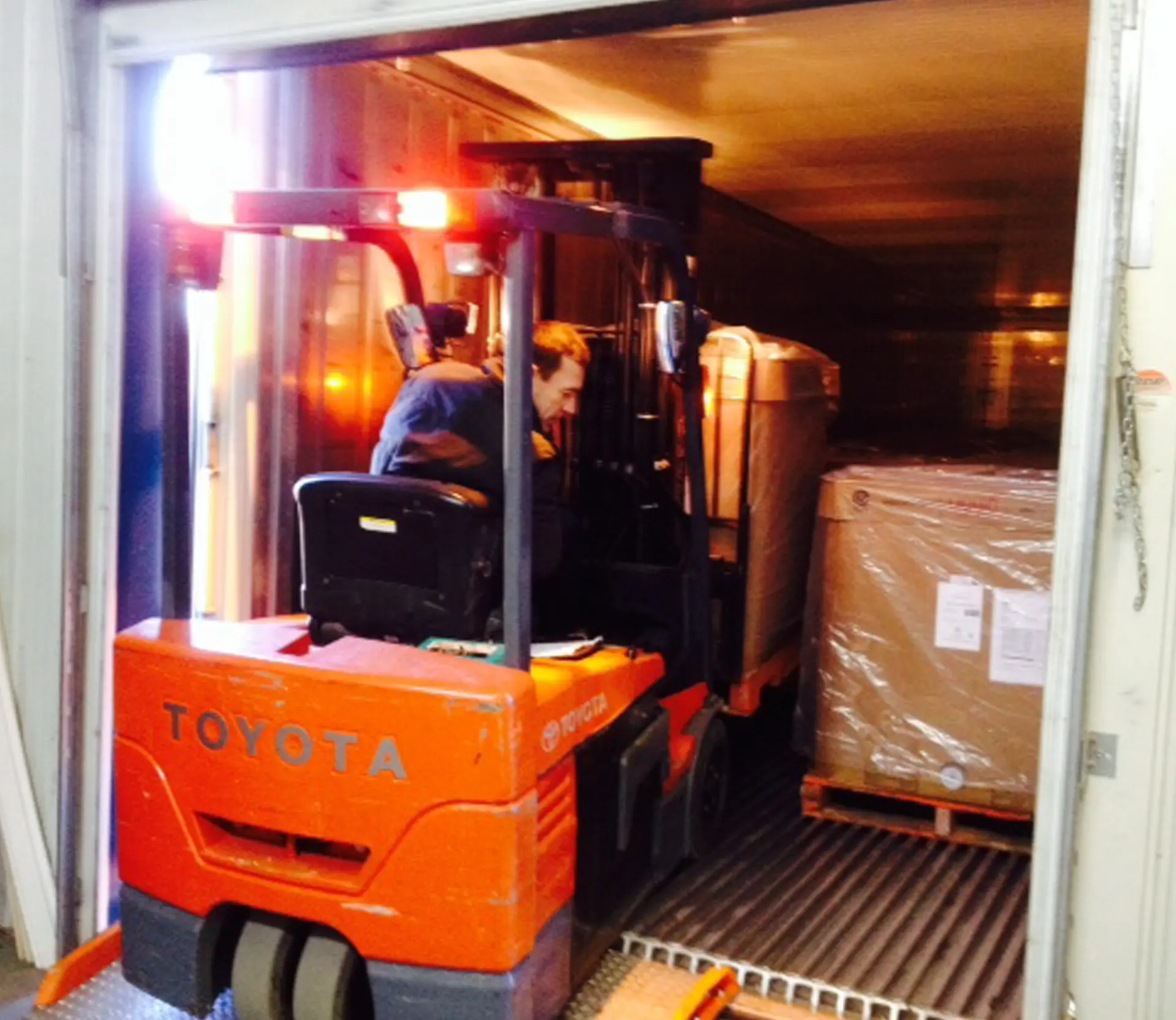 Loading pallets into a shipping container for export to Australia